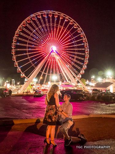 Man on one knee proposing to girlfriend.