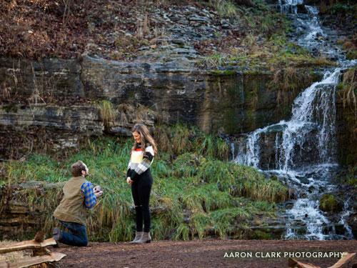 Man on one knee proposing to girlfriend.