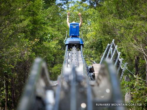 Blue mountain coaster car gliding on the track in Branson.