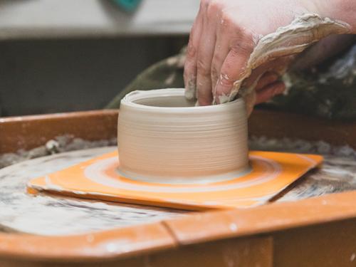 Man spinning pottery at an art studio in Branson. 