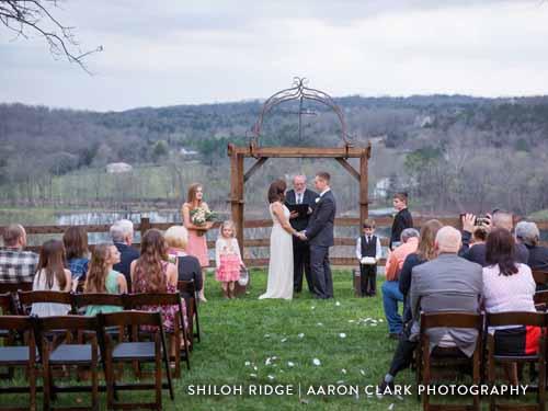 Outdoor wedding in the middle of scenic Ozark Mountains.