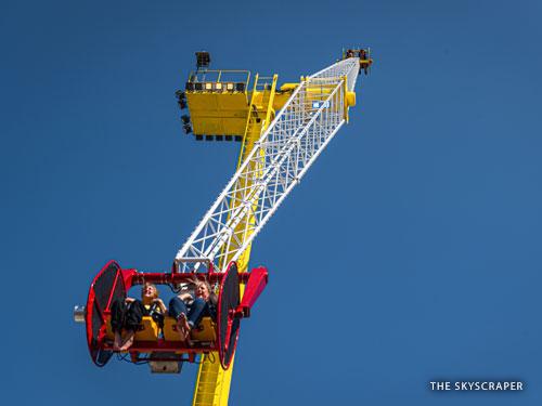 Four people riding a tall, spinning attraction in Branson.
