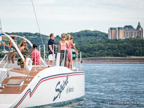 Group of business partners conversing on a catamaran in Branson.