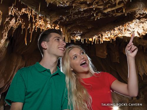 Couple amazed by the sites in an underground cave in Branson.