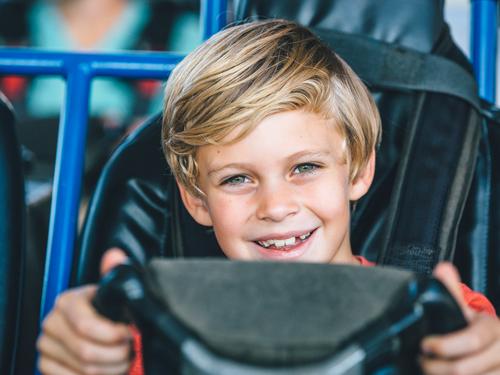 Young boy driving go-kart by himself in Branson.