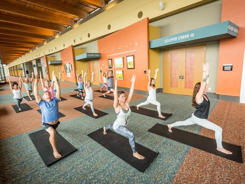 Group of people in a yoga class at a convention center in Branson.