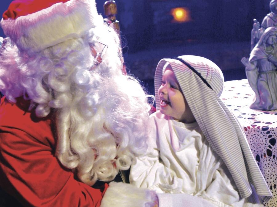 Santa shares the Good News of Jesus' birth
