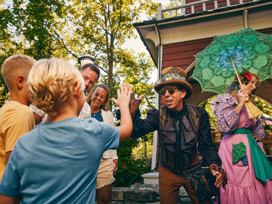 Family Gather Together In Fun