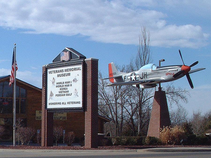 Full sized P-51 marks the location of the Veterans Memorial Museum on Hwy 76