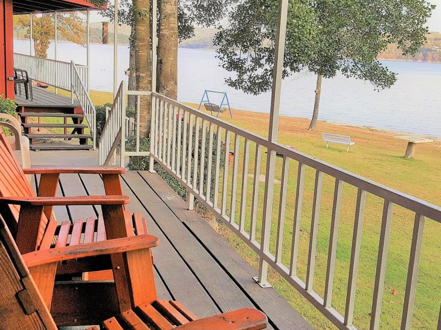 Covered porches with comfortable seating to enjoy the lakeview