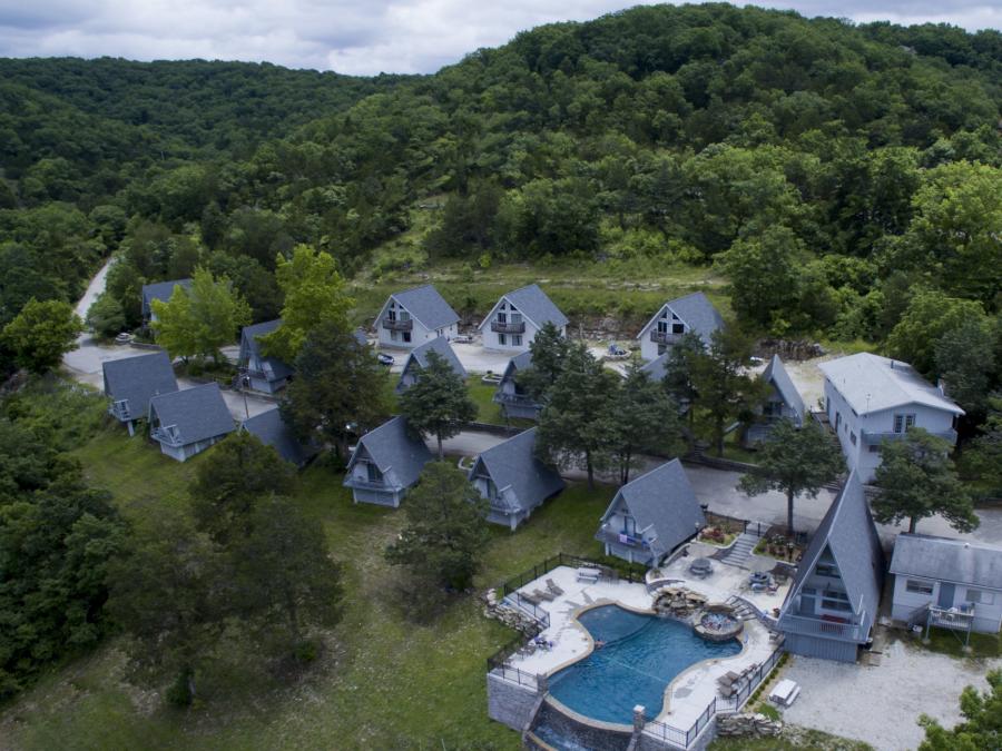 aerial view of pool and cabins