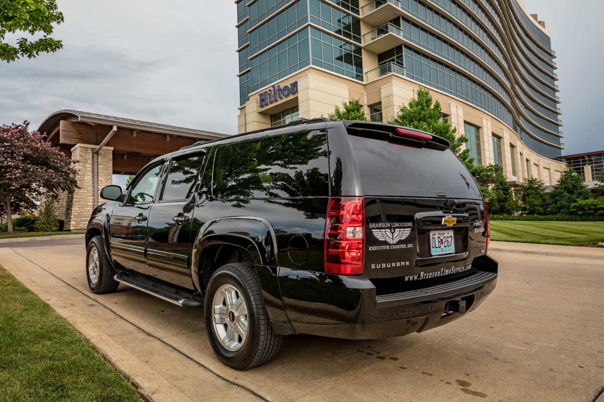 black suv in front of hilton convention center