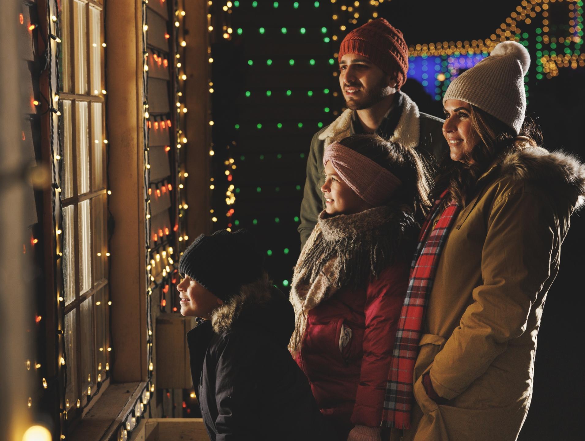 A family looking into a shop window at Silver Dollar City