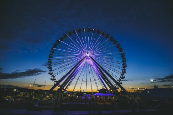 Branson Ferris Wheel lit up as sun sets behind it.
