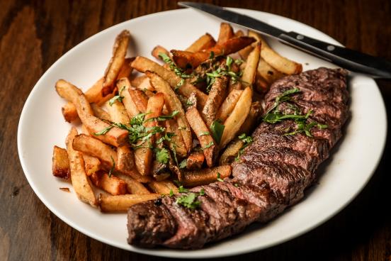 steak and fries on plate