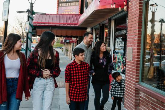 family shopping in downtown branson looking into window