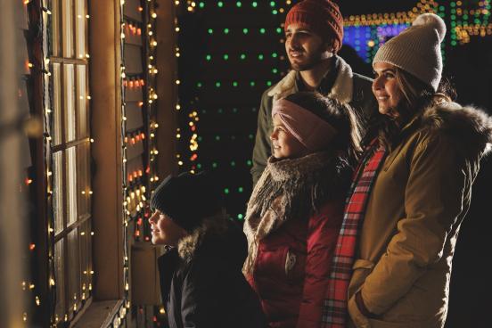 A family looking into a shop window at Silver Dollar City