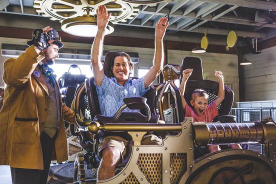 Father and son about to ride the world's tallest, fastest spinning coaster found in Branson.