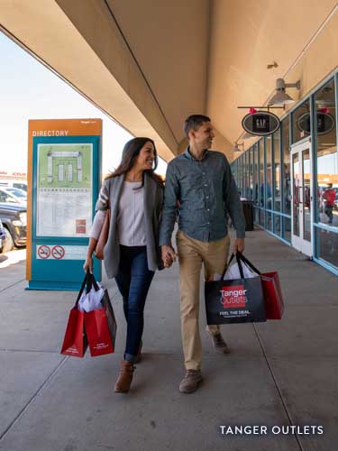 Couple shopping at Tanger Outlets