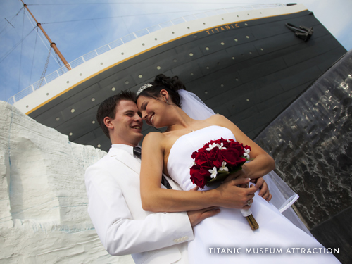 Bride and Groom standing in front of the Titanic Museum Attraction, the largest replica museum of the Titanic, in Branson.