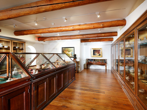 Pottery room displaying historical Ozarks pottery in a Branson museum.