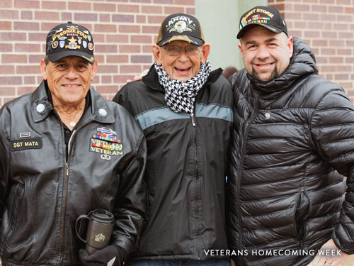 Three Veterans posing for picture at annual Veterans Homecoming Parade in Branson.